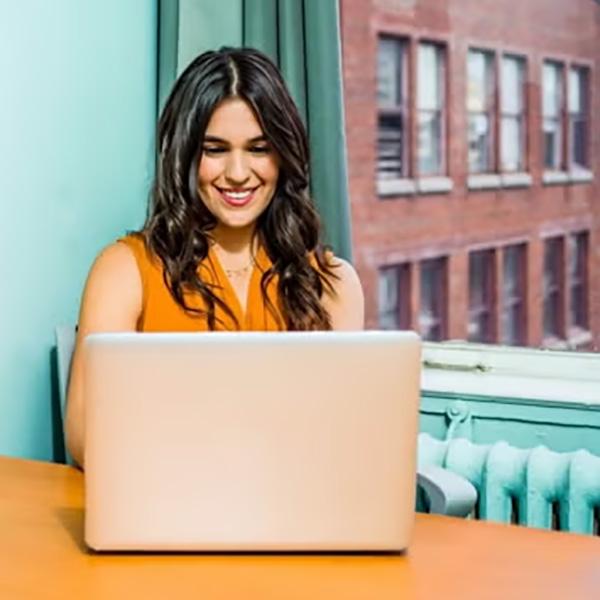 woman working remotely on laptop