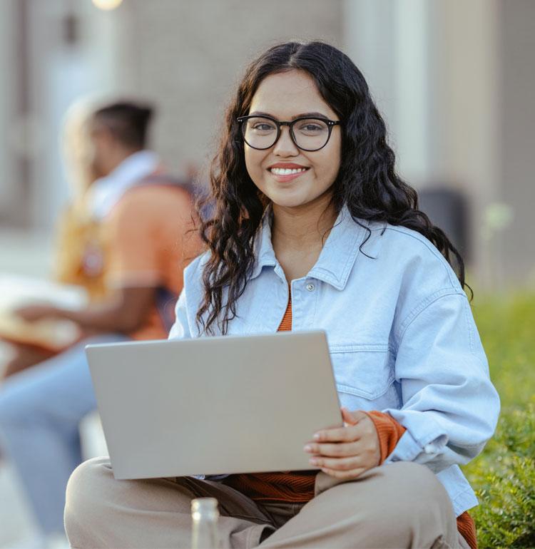 woman holding laptop